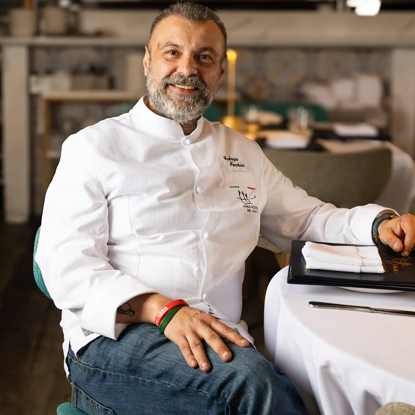 Chef Fabrizio Facchini at a table in the Stellina dining room